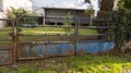 Old retro rusty sttel portal of dirty used house access door garden