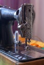 Old retro sewing machine with a needle and inserted white thread. Royalty Free Stock Photo