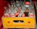 Old retro style Coca-Cola glass bottles in wooden box