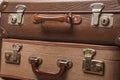 Old, retro, suitcases lie on the table with white background