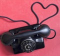 Old retro telephone with heart shape abstract