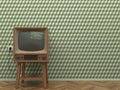 Old retro TV in the interior of the living room stands on the parquet floor on a background of a wall with green abstract wallpape Royalty Free Stock Photo