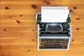 Old retro typewriter on wooden desk. Royalty Free Stock Photo