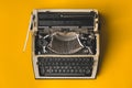 Old Retro Typewriter On A Yellow Background, Top View. Creative Royalty Free Stock Photo