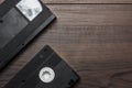 Old retro video tape on wooden background