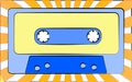 Old retro vintage antique hipster music audio cassette for a tape recorder against a background of yellow rays. Royalty Free Stock Photo