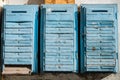 Old retro vintage blue metal mailboxes for letters and newspapers hanging on the wall of an apartment house Royalty Free Stock Photo