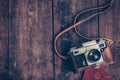 Old retro vintage camera on grunge wooden background Royalty Free Stock Photo