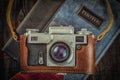 Old retro vintage camera on grunge wooden Royalty Free Stock Photo