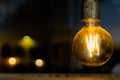 Old retro vintage incandescent light bulb. loft style. ideas concept. bokeh background and copy space Royalty Free Stock Photo