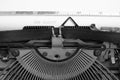 Old retro vintage typewriter. A white sheet with the printed text top secret.In black and white image