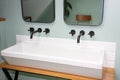 Old retro vintage washbasin style sink and faucet in interior of design modern bathroom Royalty Free Stock Photo