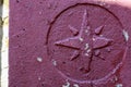 Old retro vintage Windrose symbol on stone grunge painted surface. Symbol of cartography of geographic azimuths