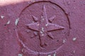 Old retro vintage Windrose symbol on stone grunge painted surface. Symbol of cartography of geographic azimuths