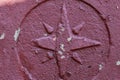 Old retro vintage Windrose symbol on stone grunge painted surface. Symbol of cartography of geographic azimuths