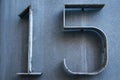 Old retro weathered metal stainless steel cold blue plate with number 15