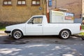 Old retro white volkswagen pickup on the street