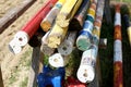 Multi colored image of show jumping poles stacked at the show jumping arena Royalty Free Stock Photo