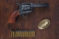 Old revolver with cartridges and U.S. Army soldier buckle