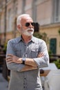 Old rich man with sun glasses and beard on street portrait Royalty Free Stock Photo