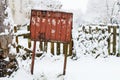 Old rickety mailbox in the winter under the snow Royalty Free Stock Photo