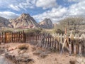 Old rickety wood picket fence in an arid landscape Royalty Free Stock Photo