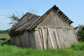Old rickety wooden barn after the strong wind Royalty Free Stock Photo