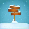 Old rickety wooden signpost with three planks covered with snow on the snowy ground. Blue background with falling snowflakes. Royalty Free Stock Photo