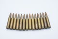 Old rifle cartridges 5.56 mm on a white background Royalty Free Stock Photo