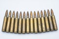 Old rifle cartridges 5.56 mm on a white background Royalty Free Stock Photo
