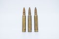 Old rifle cartridges 5.56 mm on a white background Royalty Free Stock Photo