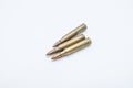 Old rifle cartridges 5.56 mm on a white background Royalty Free Stock Photo