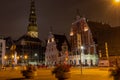 Old Riga the capital of Latvia at night. House of Blackheads in the Town Hall Square and the spire of the Cathedral in the Royalty Free Stock Photo