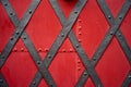 Old riveted metal red painted door