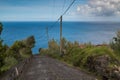 Old road down the hill with an Atlantic Ocean view Royalty Free Stock Photo