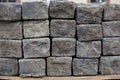 Old road granite blocks, cubes stacked together