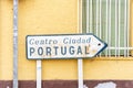 Old road sign indicating city center of Ayamonte and border with Portugal, Spain