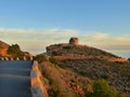 Old road and Watchtower in ruins in Sierra Helada. Benidorm.Spain . Sunset. Mediterranean Royalty Free Stock Photo