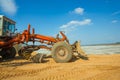 Old roadworking machine standing on sand Royalty Free Stock Photo
