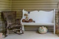 Old Rocking Chair and Bench on Porch Royalty Free Stock Photo
