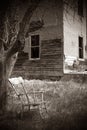Old Rocking Chair in front of Abandoned Haunted House Royalty Free Stock Photo