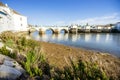 Old roman bridge over Gilao river in Tavira, Algarve, Portugal