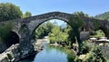 Old Roman stone bridge in Cangas de Onis. Cangas de Onis roman bridge on Sella river in Asturias of Spain Royalty Free Stock Photo