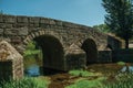 Old Roman stone bridge over the Sever River in Portagem Royalty Free Stock Photo