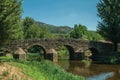 Old Roman stone bridge over the Sever River in Portagem Royalty Free Stock Photo