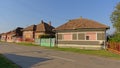 Old Romanian farm along a street with electical wiring in the air in the village of Aurel Vlaicu Royalty Free Stock Photo