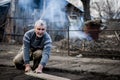 Old romanian man working his land in a traditional way with empty hands Royalty Free Stock Photo