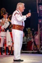 Old romanian singer in traditional costume