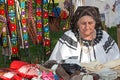 Old Romanian woman who sells traditional products at a fair Royalty Free Stock Photo