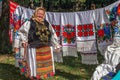 Old Romanian woman who sells traditional products at a fair